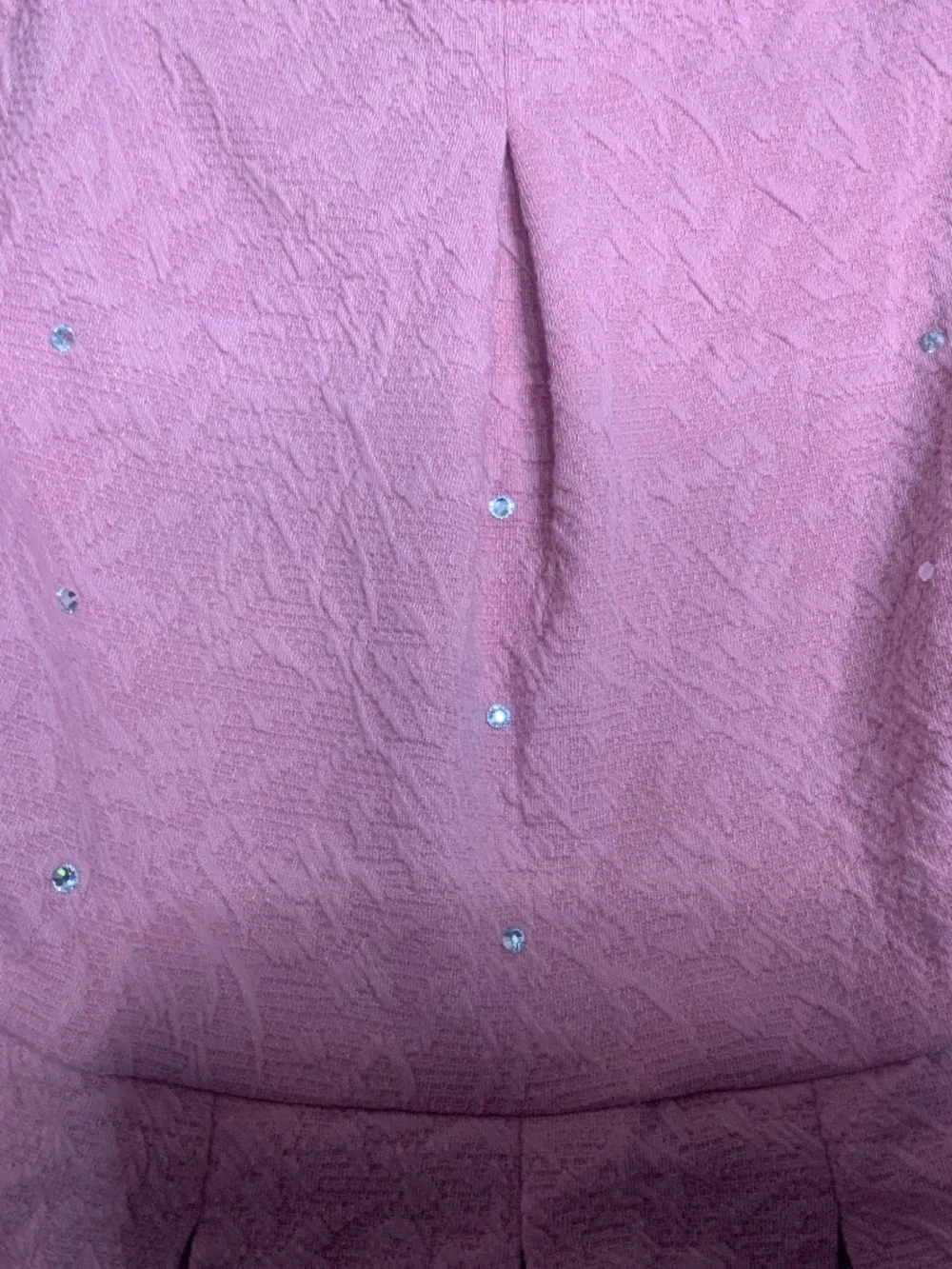 Dusty pink dress with pleated skirt and rhinestones.